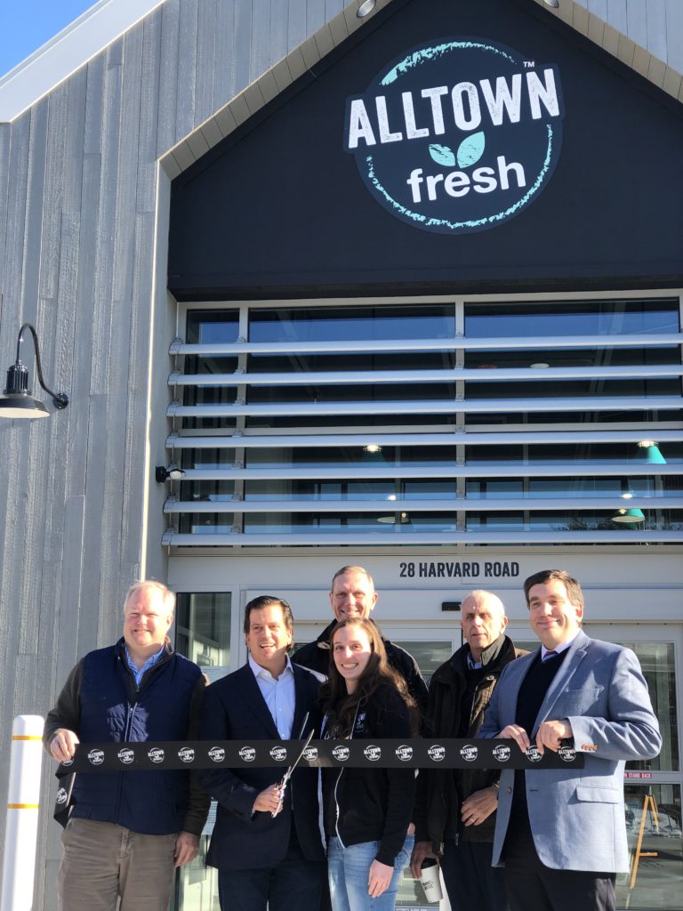 Eric Slifka and others at the ribbon cutting ceremony in front of the new Alltown fresh in Ayer, Massachusetts.